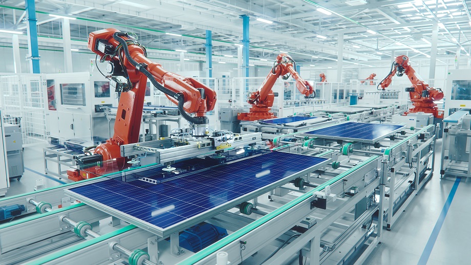 Orange Industrial Robot Arm at Production Line at Modern Bright